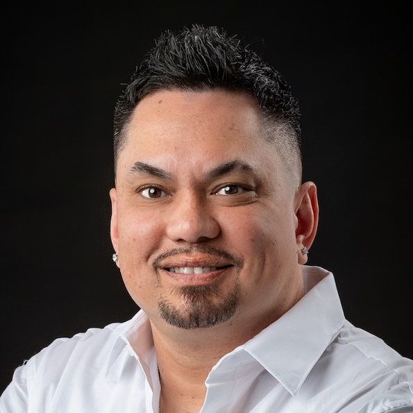 Dan Munyon, barber at Lax Haircare in Fargo, working in the modern barbershop